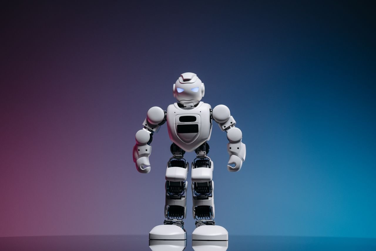 Crafting Captivating Headlines: Your awesome post title goes here A modern toy robot standing on a gradient background, showcasing innovation and technology.